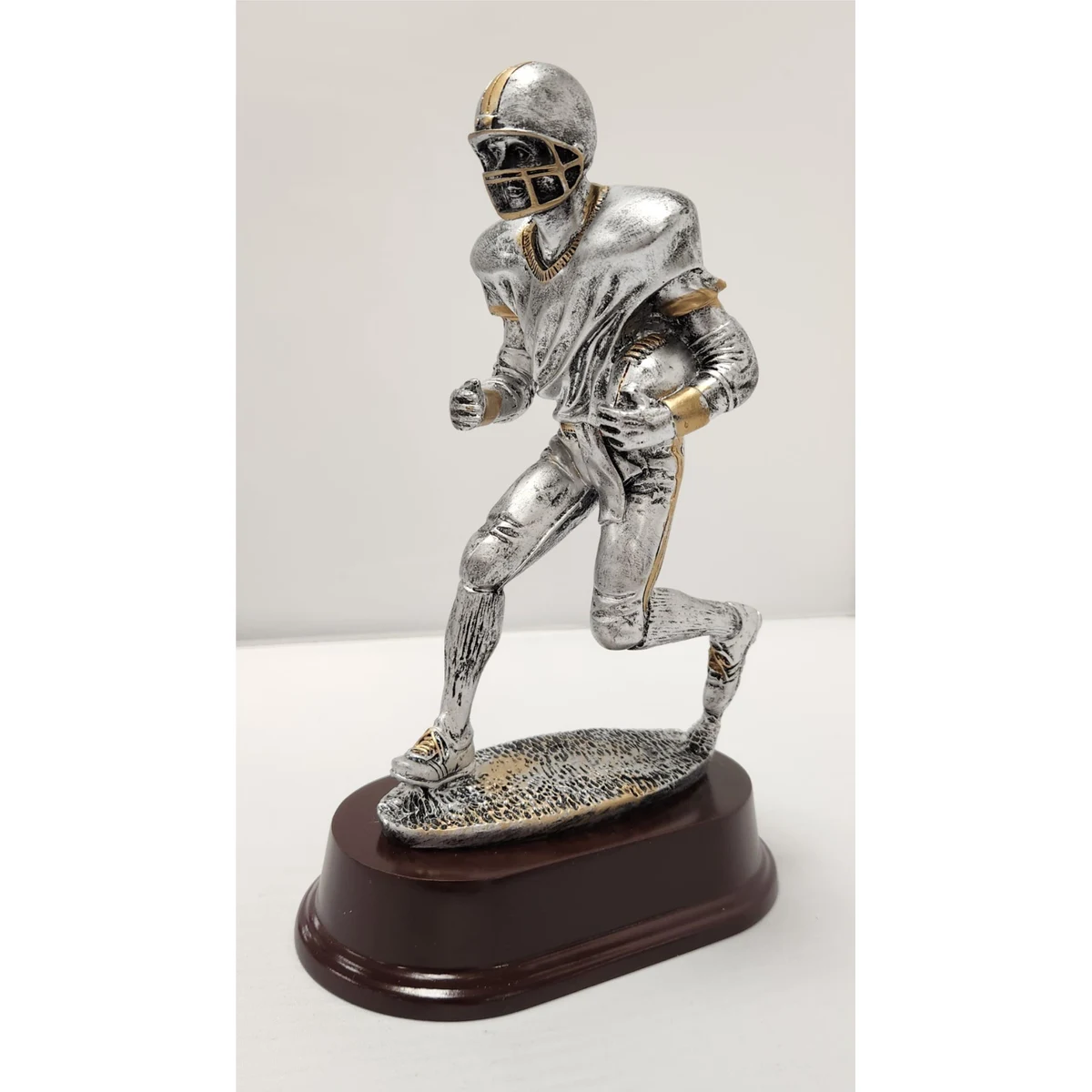 Male Running Football Figure 1