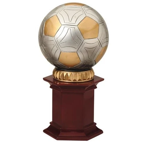 Soccer Ball resting on a rosewood stained resin pedestal. 1
