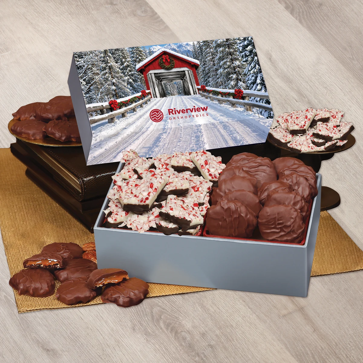 Peppermint Bark & Pecan Clusters in Gift Box with Snow-covered Bridge Sleeve 1