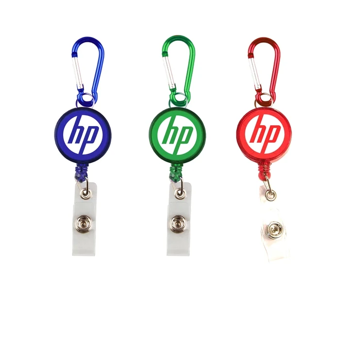 Round retractable badge holder with carabiner. 1
