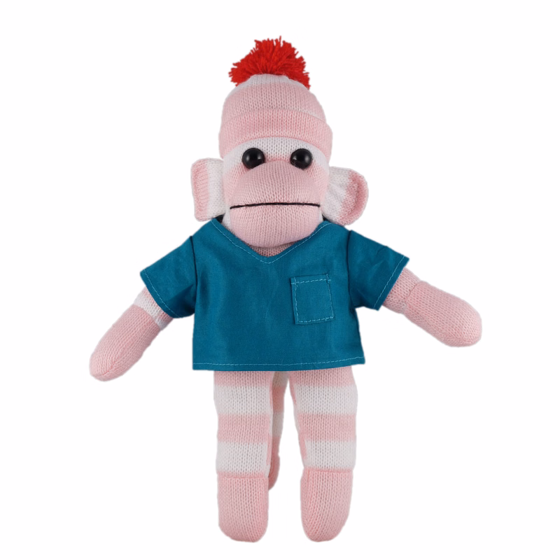 Pink Sock Monkey (Plush) in scrub shirt