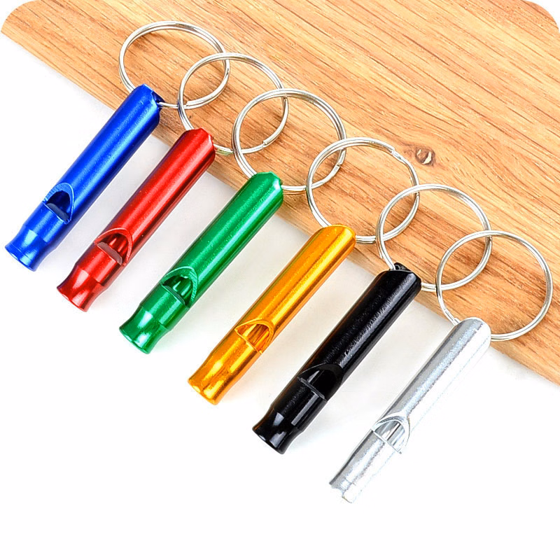 An aluminum alloy whistle with a key ring