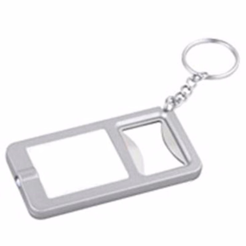 Silver/White Bottle Cap Opener with Key Chain attached.