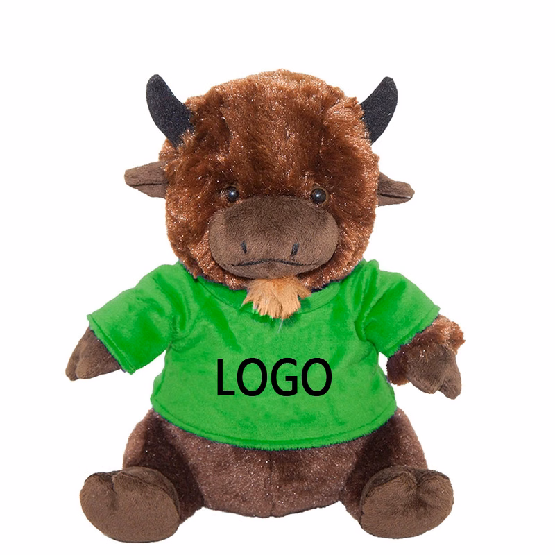 A stuffed cow in a T-shirt