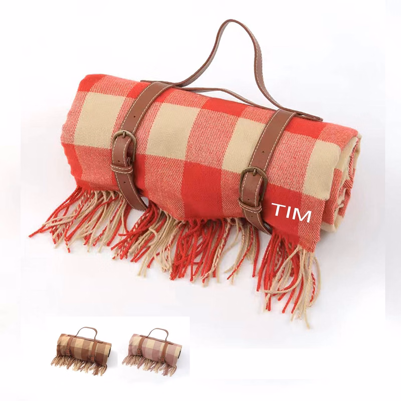 Portable picnic blanket with leather handle and tassel