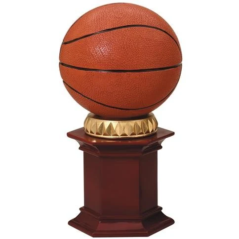 Basketball resting on a rosewood stained resin pedestal. 1