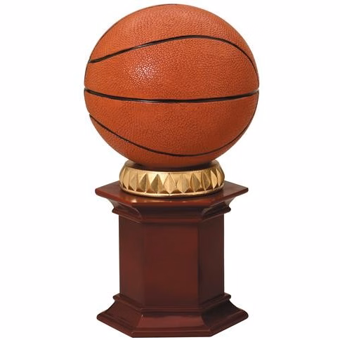 Basketball resting on a rosewood stained resin pedestal.
