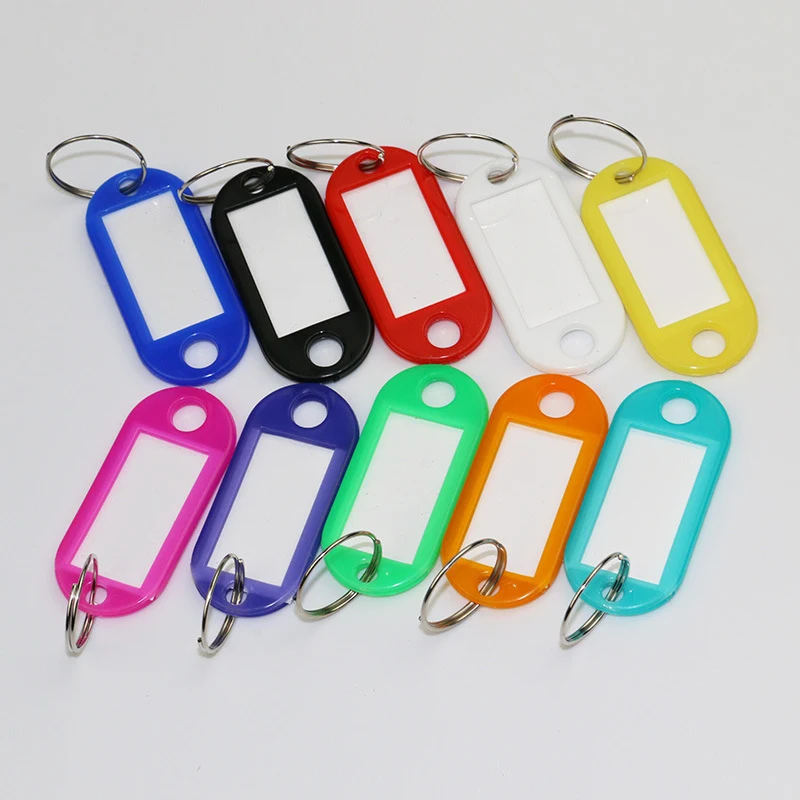 Plastic key tags with write-on inserts attached to metal key holders 1